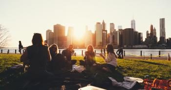 students sitting on lawn