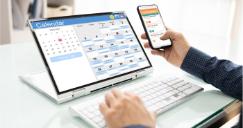 Student looking at calendar on notebook computer