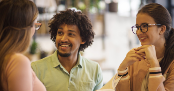 Three students having a conversation
