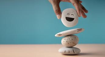 A person stacking rocks