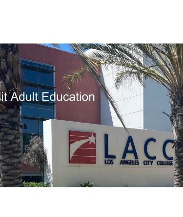 Palm trees and the Los Angeles City College logo in front of a buidling