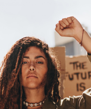 Woman raising her fist at a protest