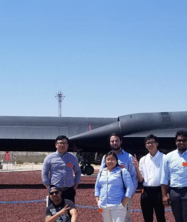 Students standing in front of NASA jet craft