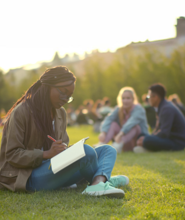 Woman reading on grass