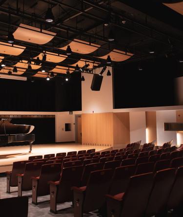 A piano on the Alpert Recital Hall stage.