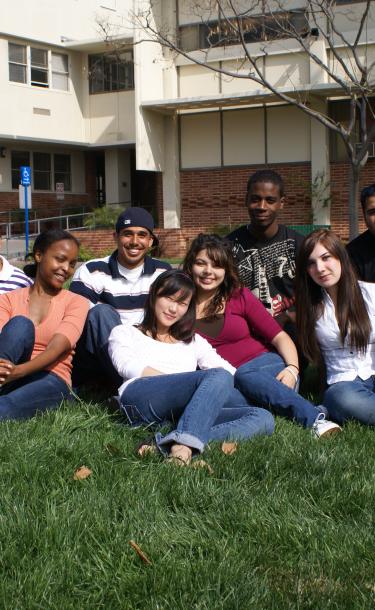 Group of Students Siting on Grass