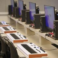 Computers set up with piano MIDI keyboards