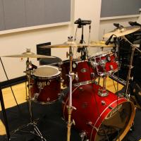 A drum kit set up in a recording studio