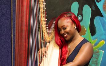 A student plays harp.