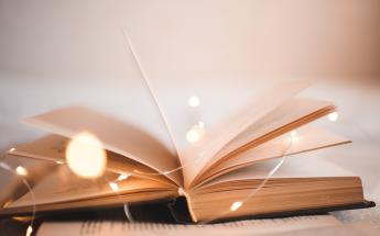 Open book with light
