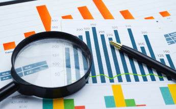 graphs and magnifying glass