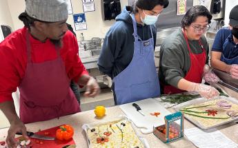 3 students preparing focaccia