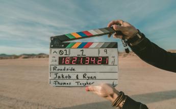 timecode slate in frame about to be clapped in the desert