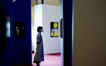 Woman standing in art gallery 