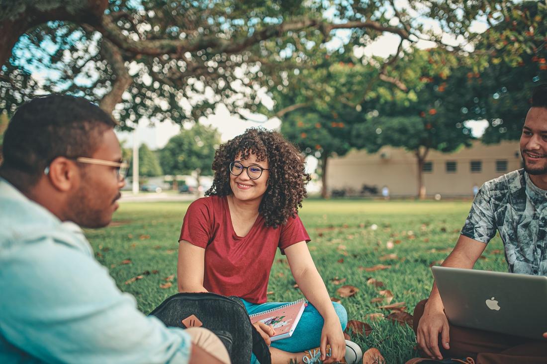 Students sitting on grass