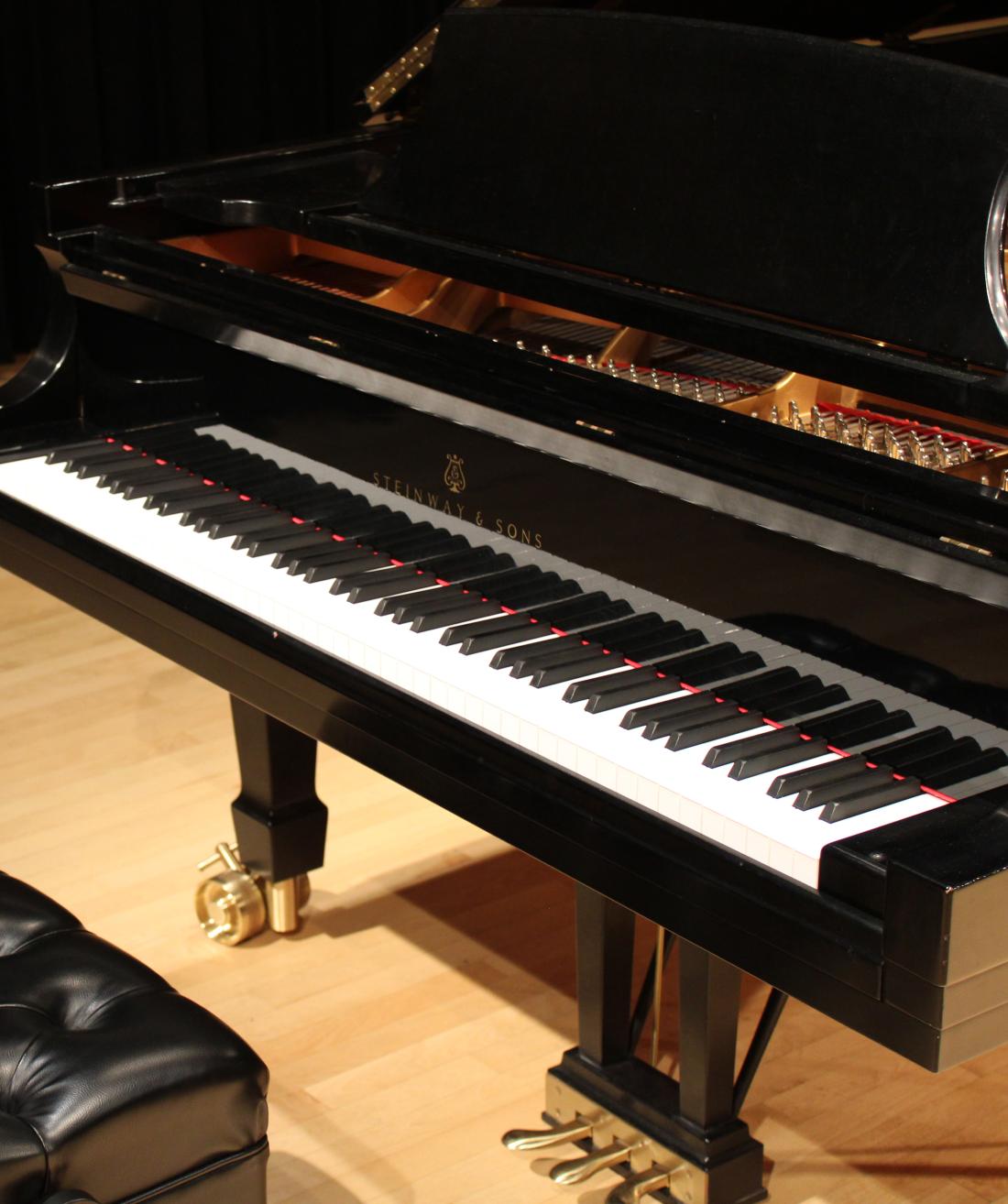 A Steinway piano on the Alpert Recital Hall stage.