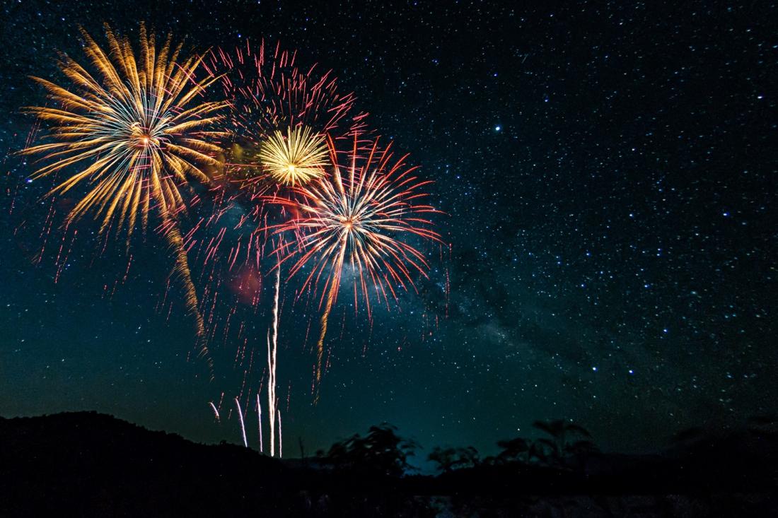 Colorful of fireworks display on milkyway in night sky background