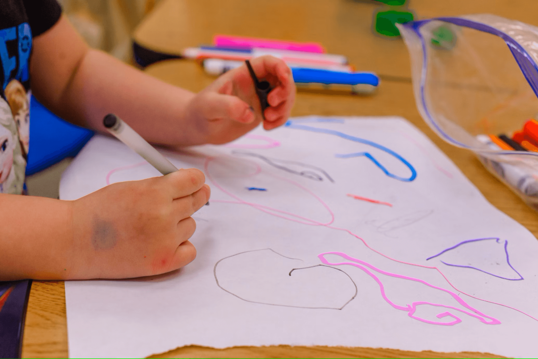 Preschool Child Creating a Drawing