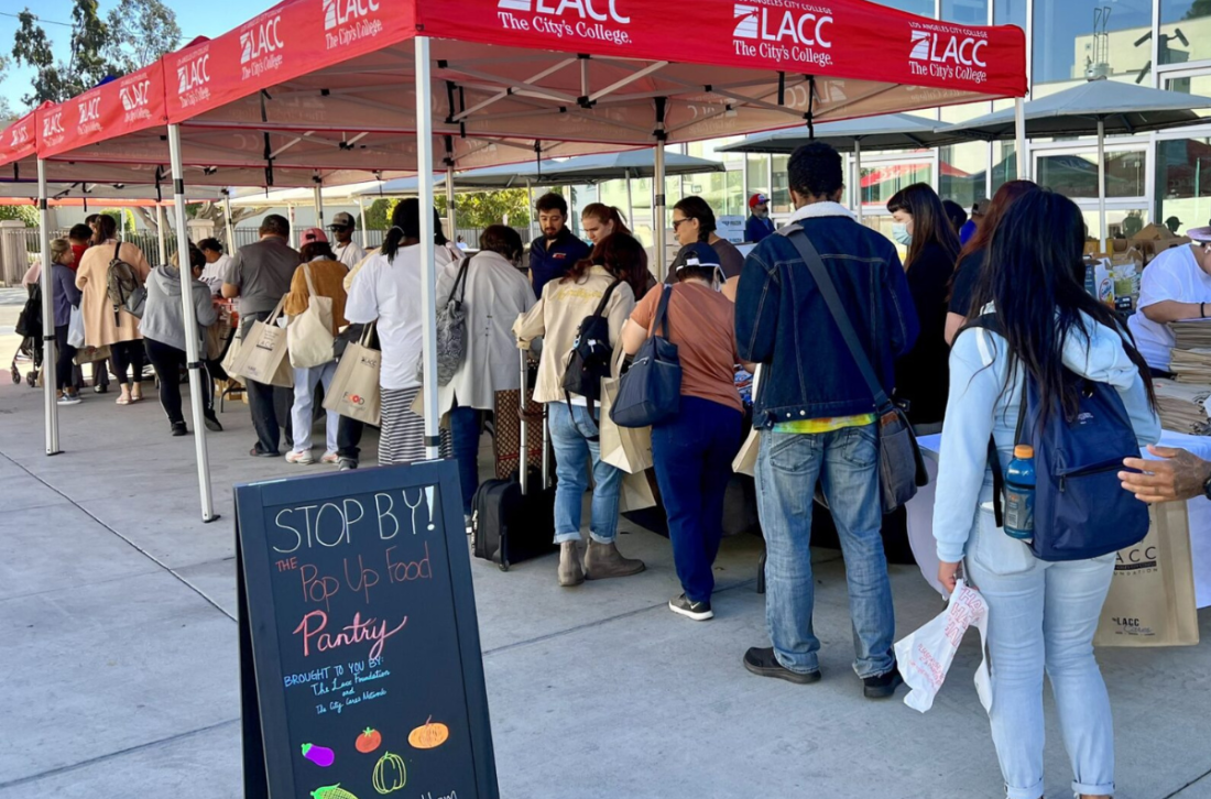 Students standing in line to pick up food 