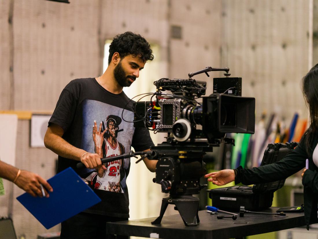 A student operating an Alexa Mini camera that he completed building