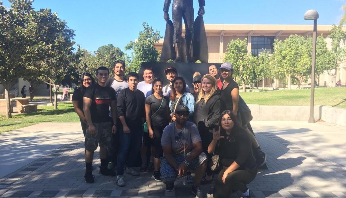 Under Statue Student Group