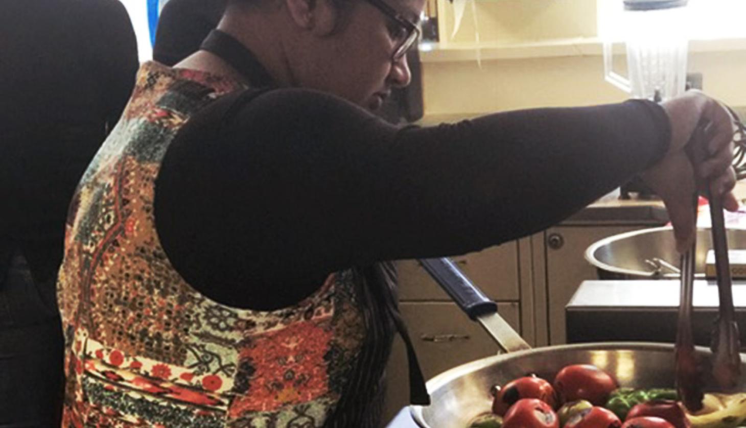 Young Woman Cooking Vegetables